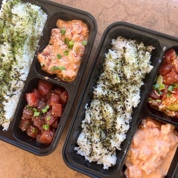 Poke Express poke trays with salmon and ahi over furikake rice